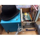 A collection of mid 20th Century childrens books, a vintage bowler hat and a water pump.