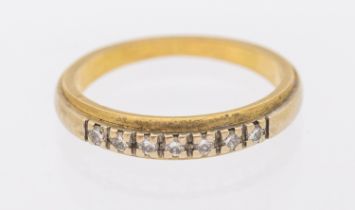 A diamond and 18ct gold ring, comprising seven round brilliant cut diamonds claw set to a tapered