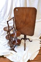 A 19th Century square top tilting wine table with a 1930s double mahogany fold out cake stand.