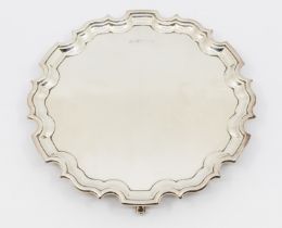 A Modern silver salver, on three scrolled feet, pie crust edging, hallmarked by Carrs, Sheffield,