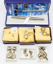 A collection of jewellery to include various silver and white metal earrings (mainly studs) some