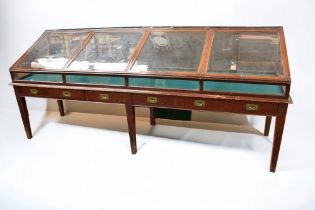 An early 20th century probably WWI period Museum display cabinet, on four legs, with separate glazed