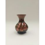 A 1940's Walter Moorcroft Flambe Clematis vase , approx 6" tall, impressed signature to base , no