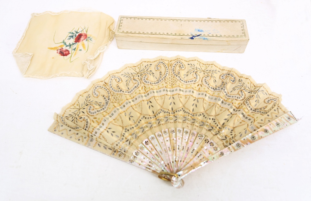 A fan with mother-of-pearl sticks and body in a decorative pattern of gold sequins in a garland - Image 2 of 3