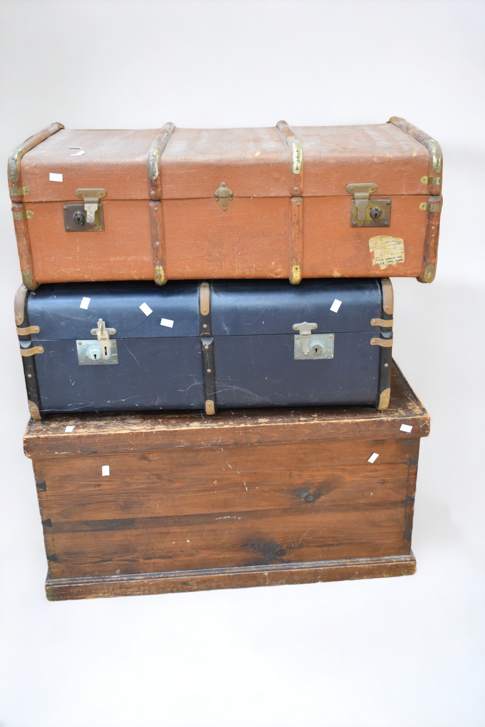 A Victorian chest circa 1850 along with two 1920s travel trunks.
