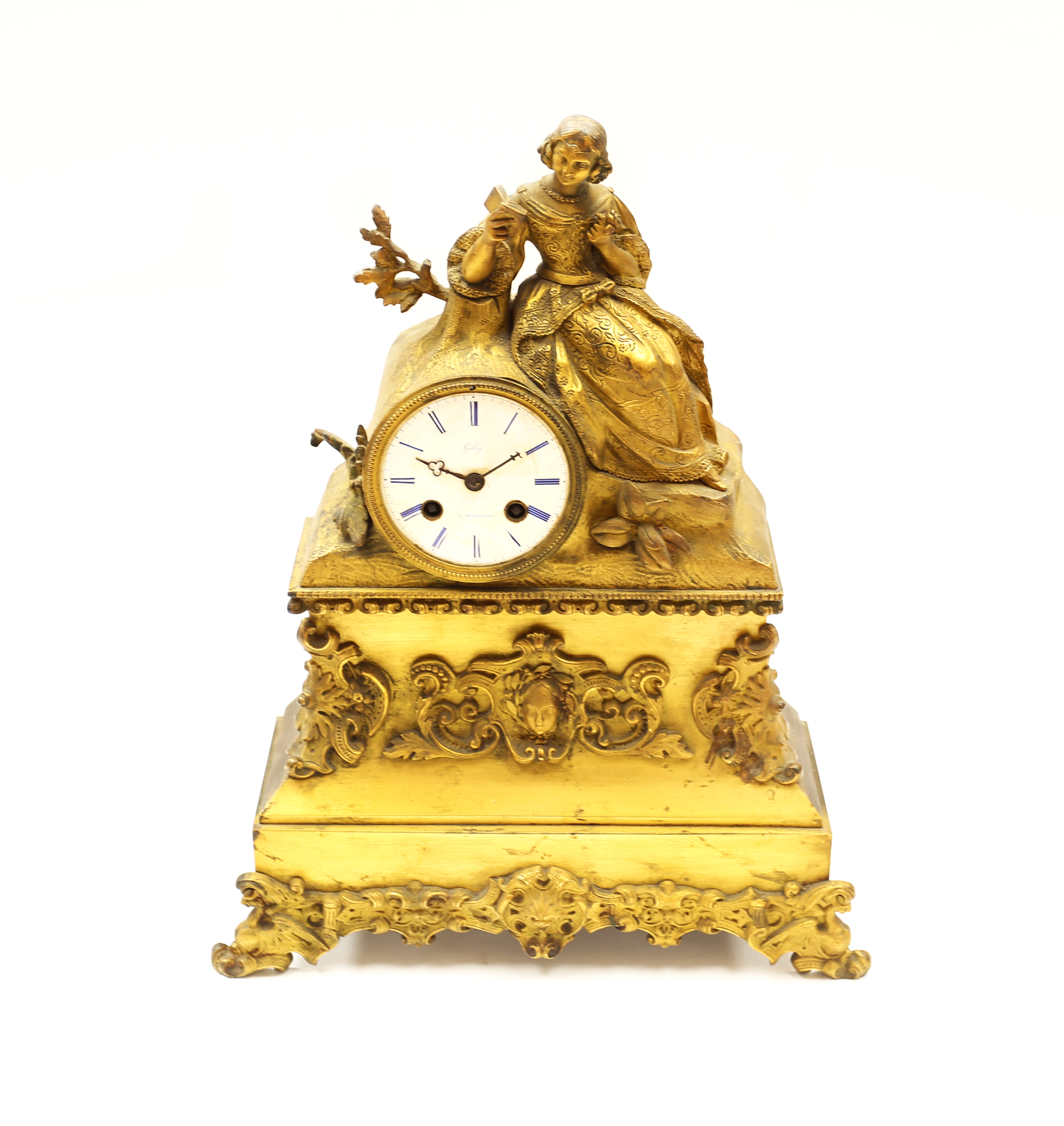 A 19th century French table clock, gilt brass with lady figural decoration to top next to circular