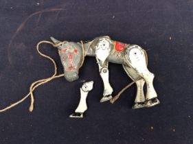 A 1960s Muffin The Mule metal childs toy.