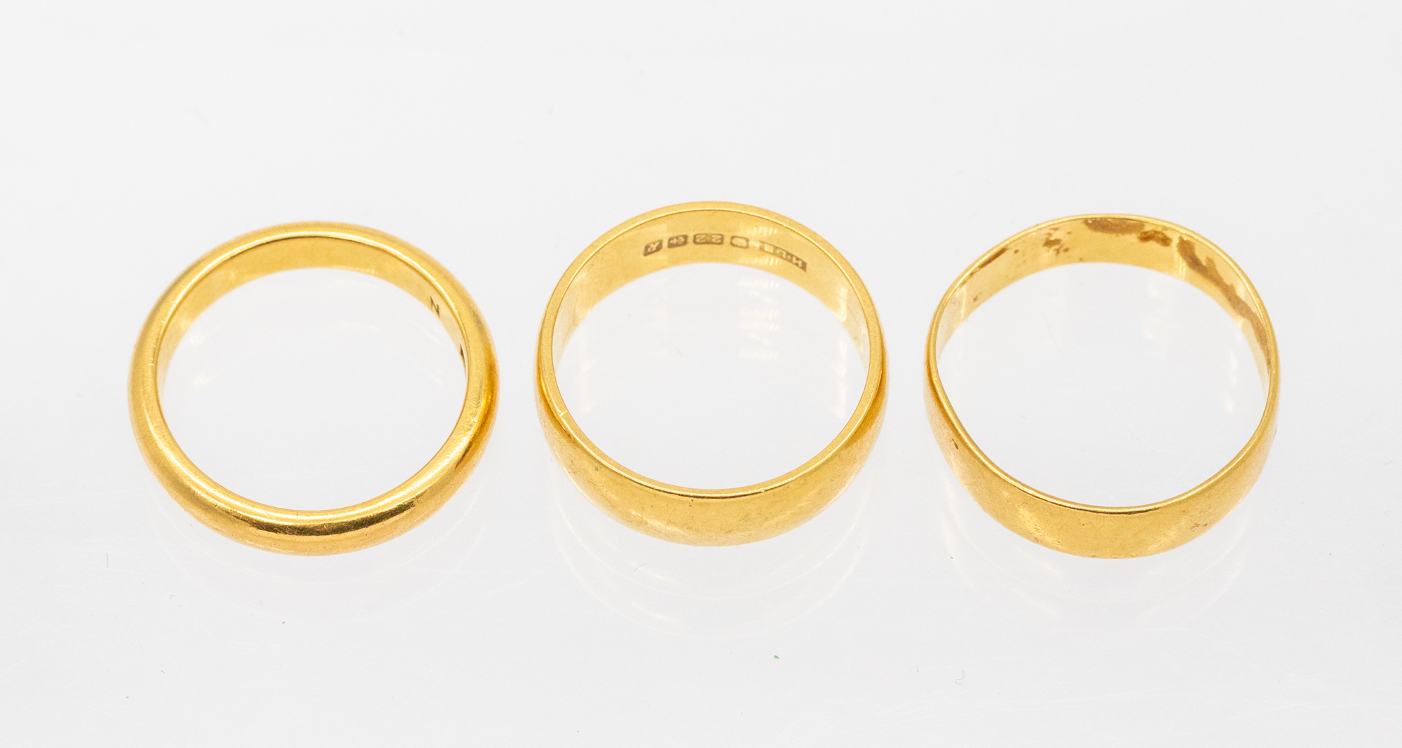 Three 22ct gold bands. various widths and sizes, weight approx 13.8gms  Further details: minor - Image 2 of 2
