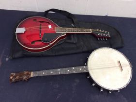 Ashbury modern mandolin along with a vintage banjo.