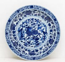A 20th Century Chinese blue and white reproduction of a Yuan Dynasty dish, painted with a qilin