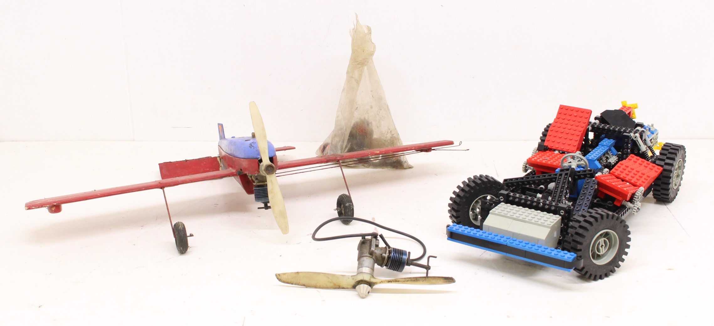 Models: A model of an airplane, together with a Lego model of a car. Along with a collection of