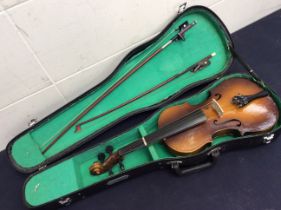 A cased 20th Century violin with two bows, Chinese manufacturer.