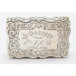 A Victorian silver snuff box, of scrolled form, ornate chasing and engraving to all sides,