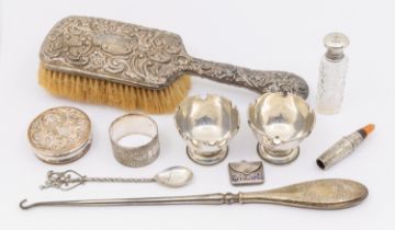 A collection of mixed silver items to include; a late Victorian silver hand brush, foliage/floral