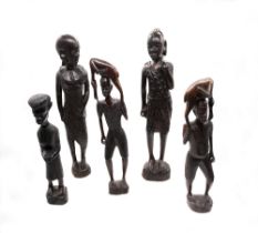 A collection of five hardwood and ebony African carved figures, central African tribal.