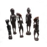 A collection of five hardwood and ebony African carved figures, central African tribal.