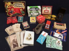 A collection of vintage boxed toys, games, playing cards, belts and a collection of early 20th