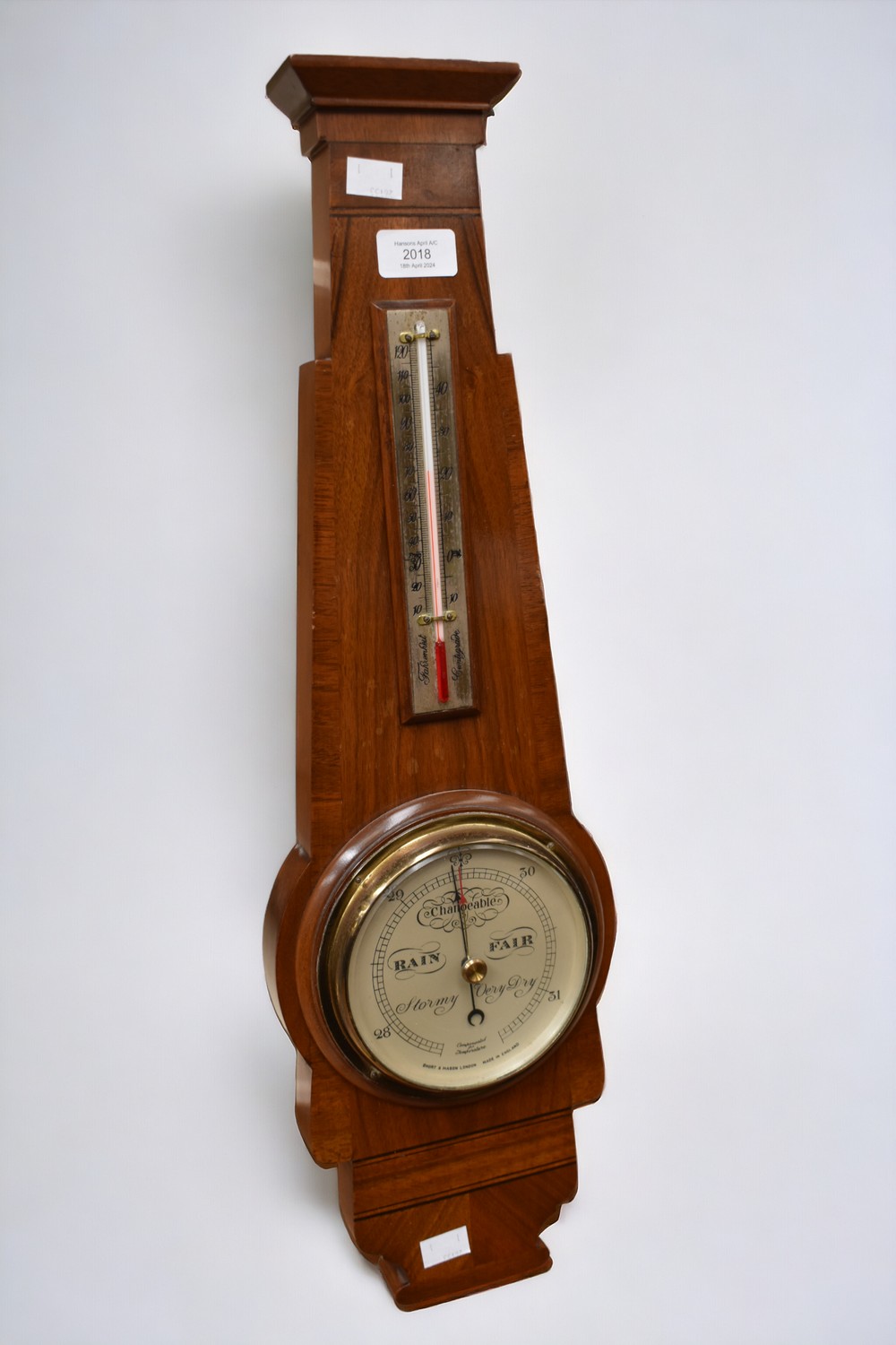 A barometer in the Art Deco style by Short & Mason, London.