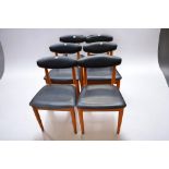 Six 1970s Schreiber dining chairs with black plastic back and seat rests.
