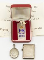 A silver and enamel limited edition Jubilee pendant, 23/25 with original certificate dated 1977,