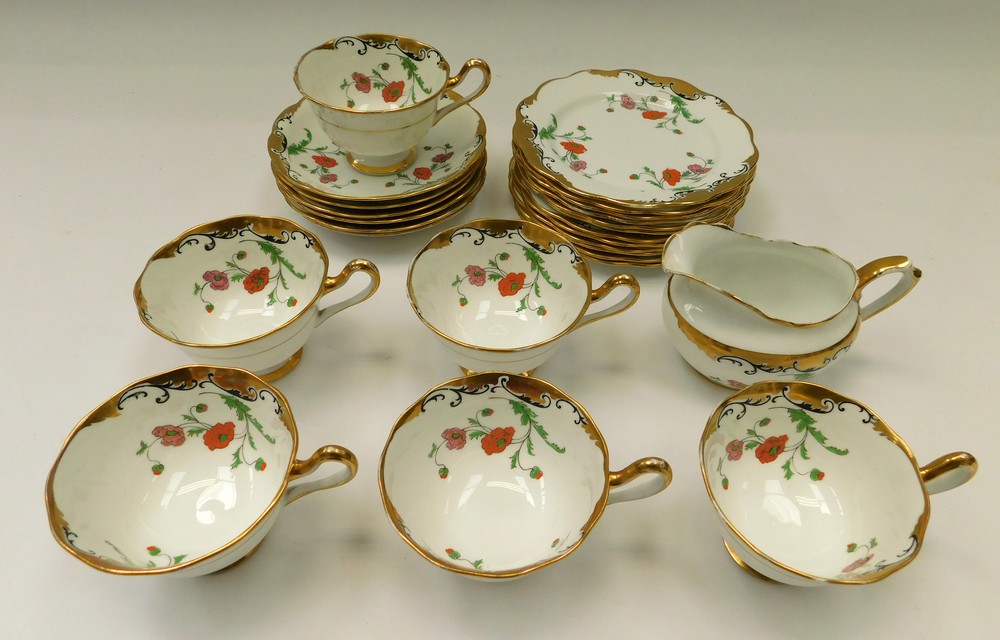 Royal Albert china teawares to include; six cups and saucers, twelve side plates and a cream jug. In