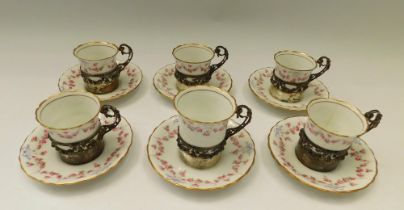 A set of six Royal Doulton rose garland and ribbon pattern silver-holder cups and saucers, cup