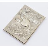 A Chinese white metal card case, with stylised dragon embossed design to both sides, central