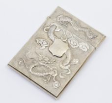 A Chinese white metal card case, with stylised dragon embossed design to both sides, central