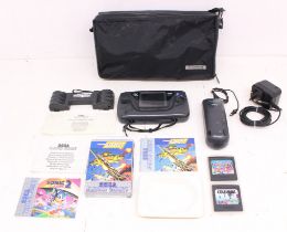 Sega: A Sega Game Gear Portable Game Console, together with Columns and Sega Game Pack 4 in 1 game