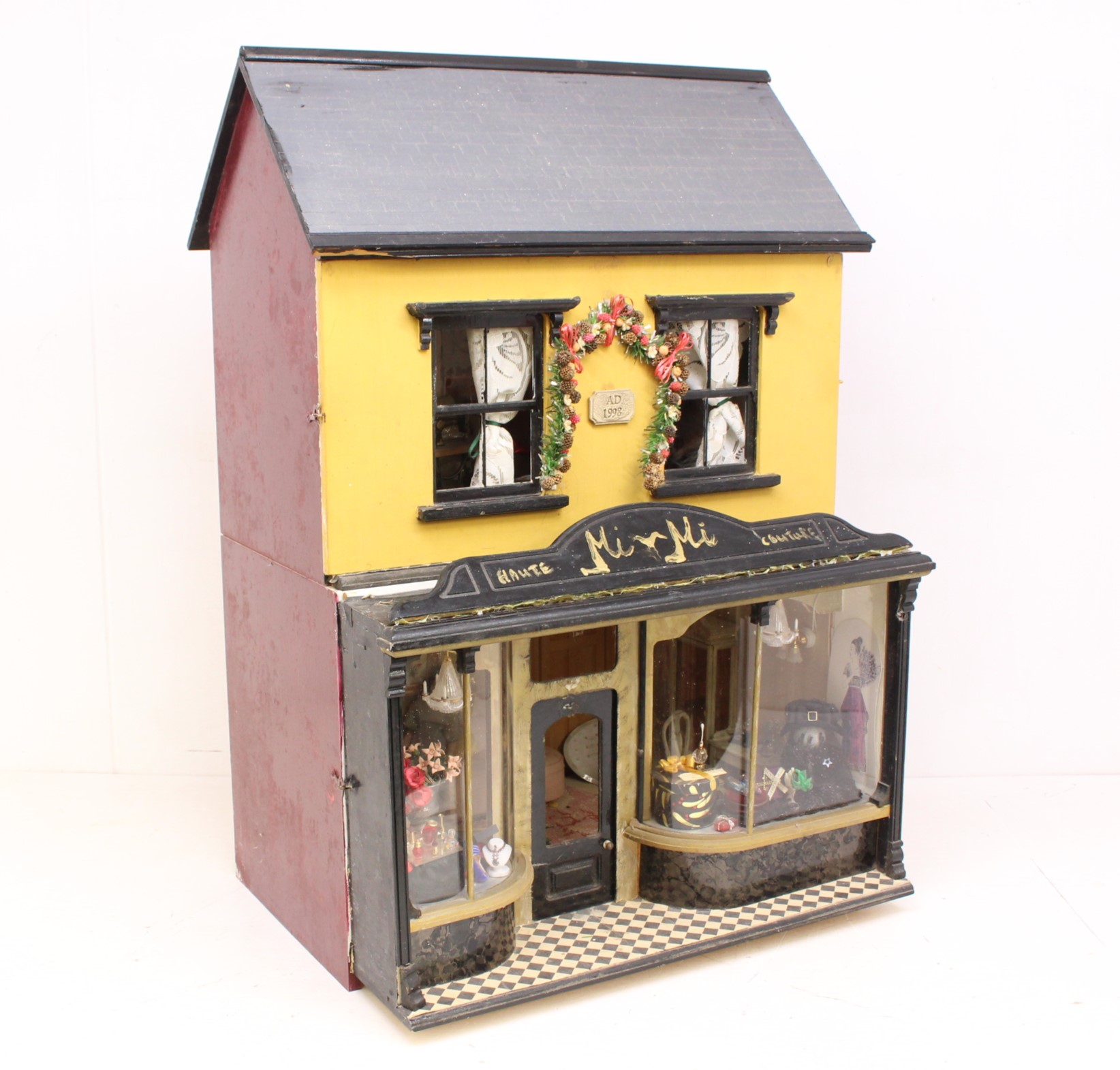 Dolls House: A mid-20th century kit-built two-storey dolls house, the lower floor comprising a