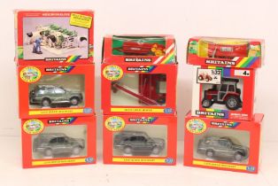 Britains: A collection of nine boxed Britains scale models to include: four Land Rover Discovery