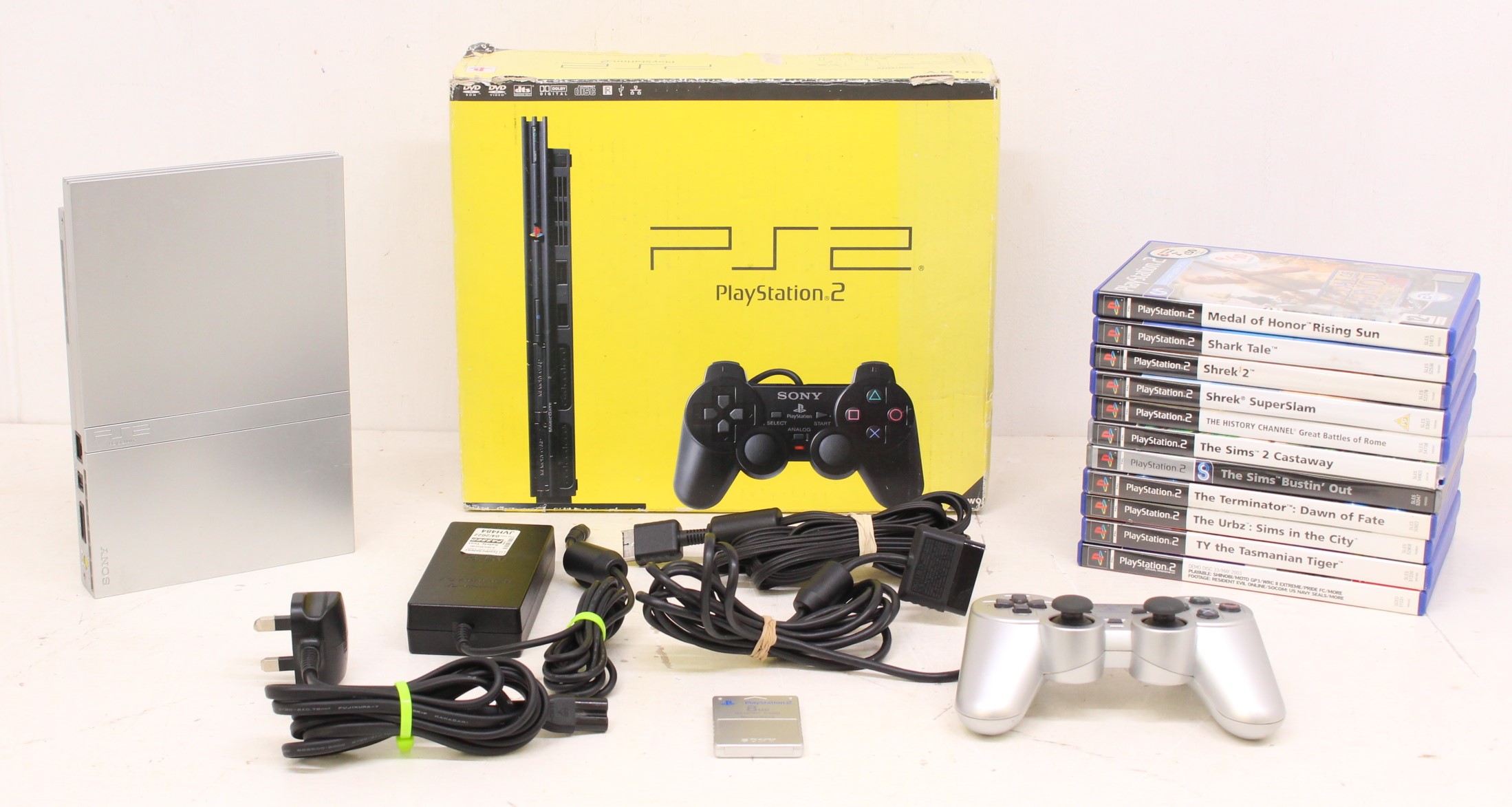 Playstation: A boxed Sony Playstation 2 Slim console; together with a collection of games,