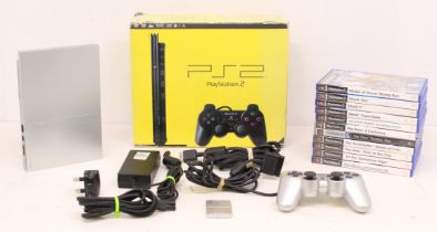 Playstation: A boxed Sony Playstation 2 Slim console; together with a collection of games,