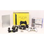 Playstation: A boxed Sony Playstation 2 Slim console; together with a collection of games,