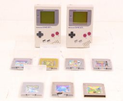 Game Boy: A pair of original Nintendo, Game Boy handheld consoles, Reference DMG-001. Together