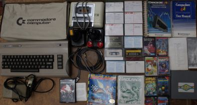 Commodore: A collection of assorted Commodore 64 items to include: computer, joysticks, and