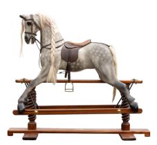 Horsecraft: A late 20th century, Horsecraft dapple grey rocking horse on wooden base, glass eyes,