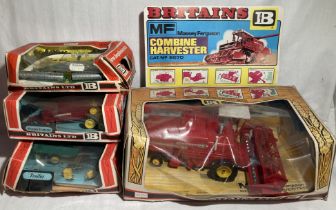 Britains: A collection of assorted boxed Britains Farm implements to include: Massey Ferguson