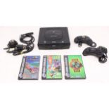 Sega: An unboxed Sega Saturn console, with power supply and two controllers; and a collection of