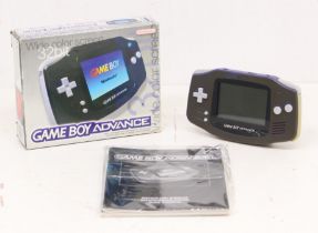Game Boy: A boxed Nintendo Game Boy Advance console, black console with purple back and
