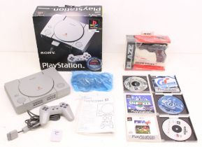 Playstation: A boxed Sony Playstation console, SCPH-1002; together with a boxed Blaze Scorpion II