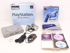 Playstation: A boxed Sony Playstation console, SCPH-9002B; together with a boxed Namco G-Con 2,
