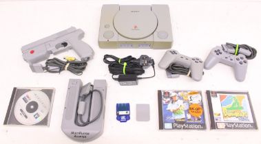 Playstation: An unboxed Sony Playstation console, SCPH-1002; together with two controllers, Namco