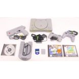 Playstation: An unboxed Sony Playstation console, SCPH-1002; together with two controllers, Namco