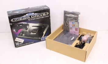 Sega: A boxed Sega Mega Drive console, complete with instruction manual, power cable, one official