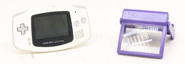 Game Boy: An unboxed Nintendo Game Boy Advance console, white console; and a collection of four