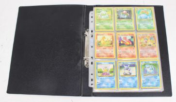 Pokemon: A collection of assorted Pokemon cards, contained within one folder to include: Wizards
