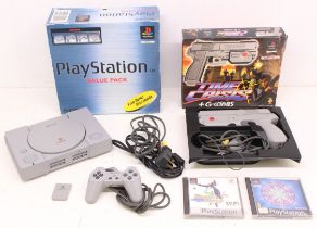 Playstation: A boxed Sony Playstation console, SCPH-5552B; together with a boxed Namco Time Crisis +