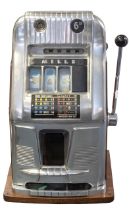 One-Arm Bandit: A Hi-Top One-Arm Bandit, a vintage coin operated slot machine, plays and pays out,