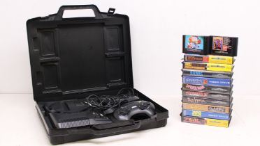 Sega: A cased Sega Mega Drive console, with two controllers; and a collection of twelve games (ten
